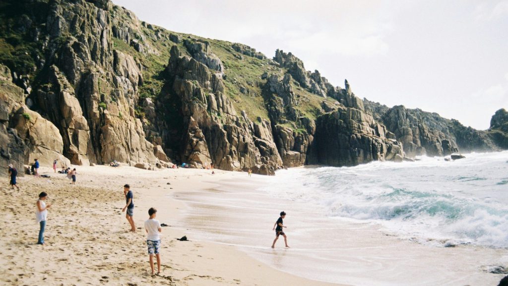 Children playing on a UK beach on a sunny day